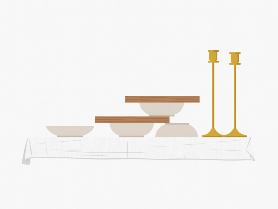 Flat vector cross-section of a Christmas table showing base linen layer, elevated wooden risers on inverted bowls, and rear brass candlesticks